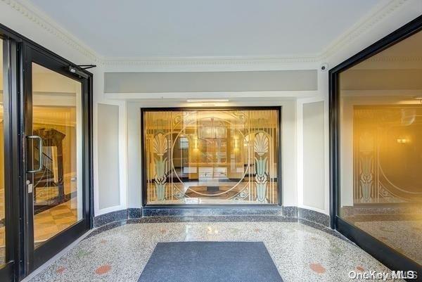 interior space with crown molding