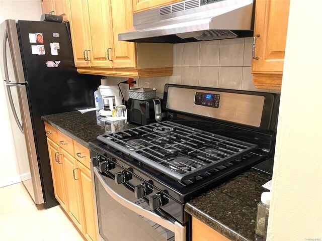 119-49 Union Tpke Unit 7E, Forest Hills, NY 11375 - kitchen with stainless steel appliances, range hood, dark stone counters, light tile patterned floors, and backsplash