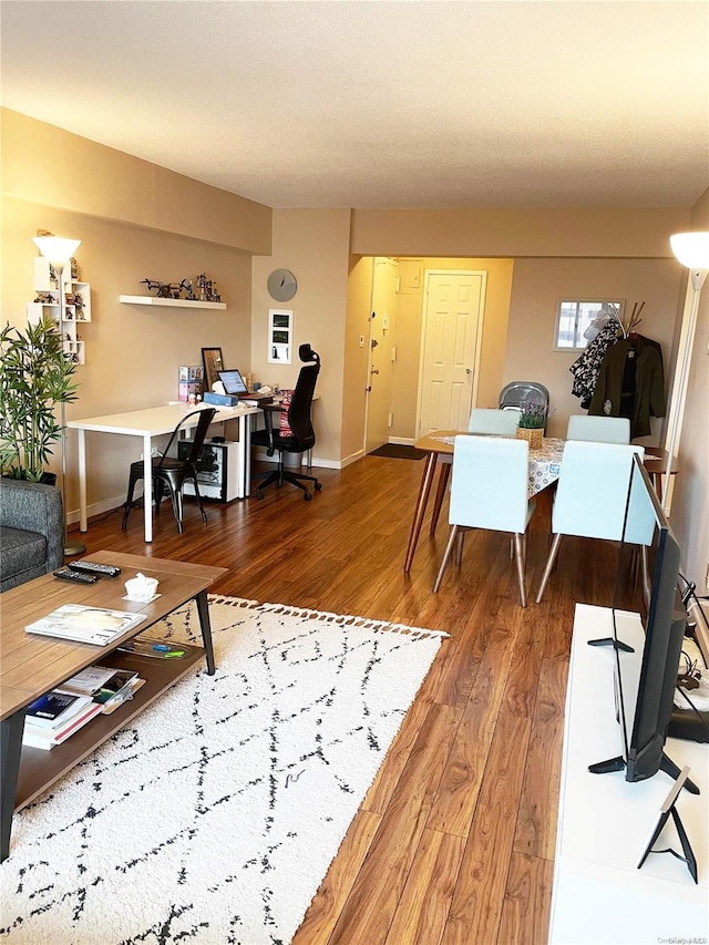 119-49 Union Tpke Unit 7E, Forest Hills, NY 11375 - living area with wood finished floors, an office area, and baseboards