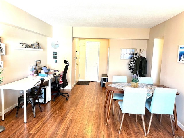 dining area with hardwood / wood-style floors