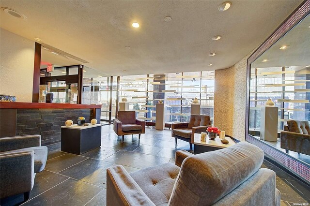 119-49 Union Tpke Unit 7E, Forest Hills, NY 11375 - common area featuring expansive windows, recessed lighting, and a textured ceiling