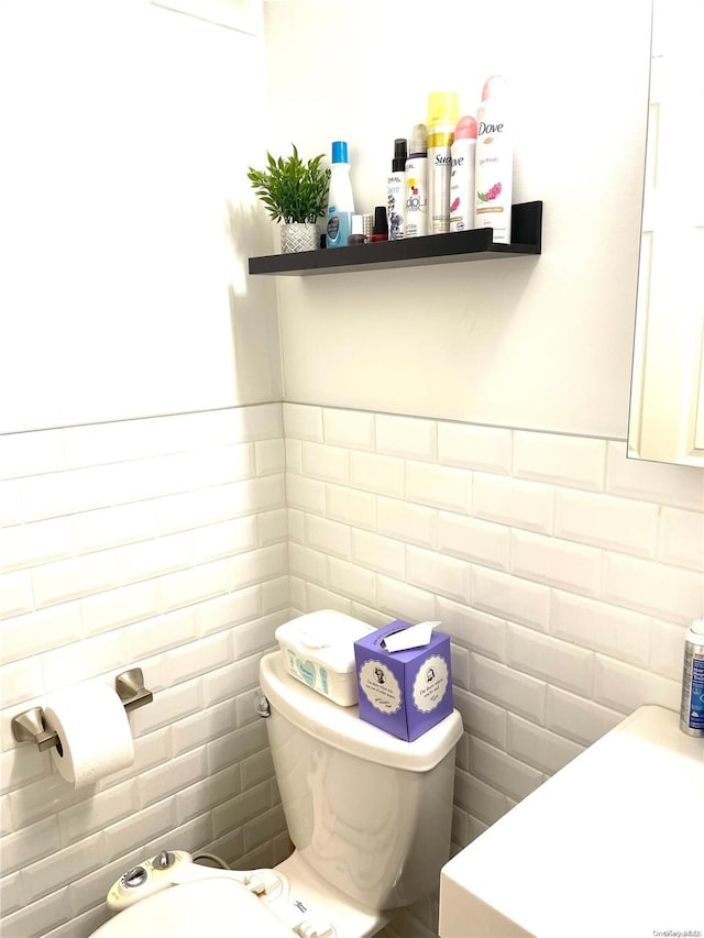 119-49 Union Tpke Unit 7E, Forest Hills, NY 11375 - bathroom featuring tile walls, toilet, and a bidet