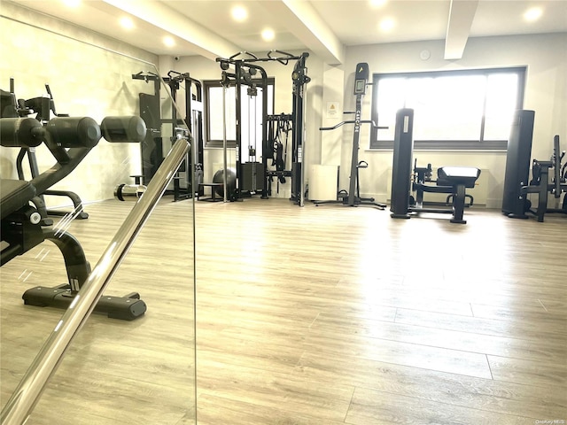 workout area with hardwood / wood-style flooring