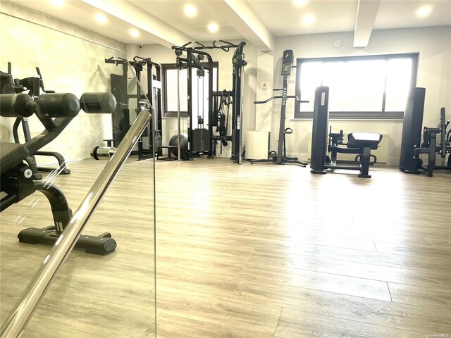 119-49 Union Tpke Unit 7E, Forest Hills, NY 11375 - exercise room with wood finished floors, recessed lighting, and beamed ceiling