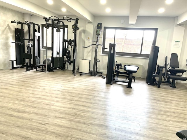 gym with light hardwood / wood-style flooring