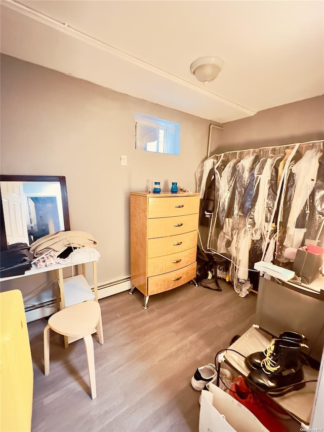 interior space featuring hardwood / wood-style floors and a baseboard radiator