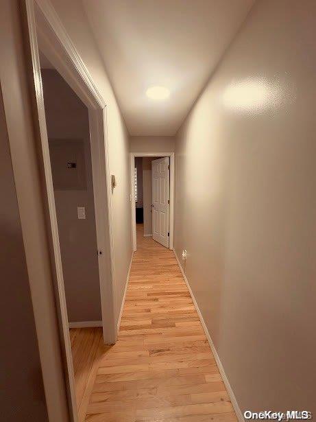 corridor featuring light hardwood / wood-style flooring