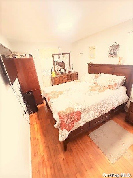 bedroom featuring wood-type flooring