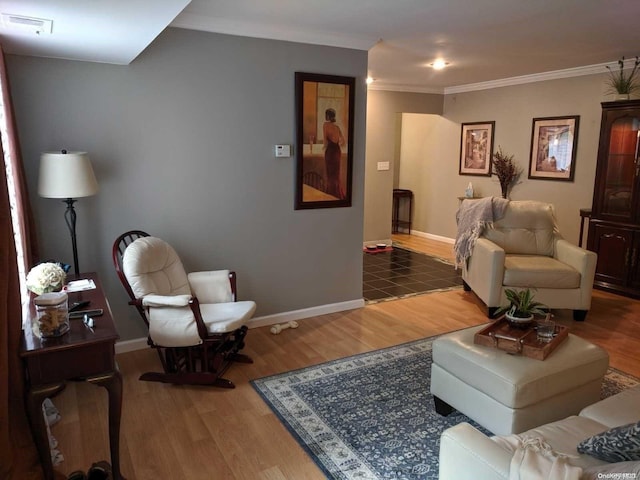 living room featuring wood-type flooring and crown molding