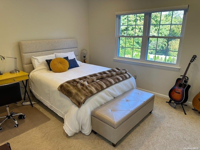 bedroom featuring light colored carpet