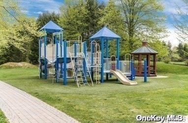 view of jungle gym featuring a lawn