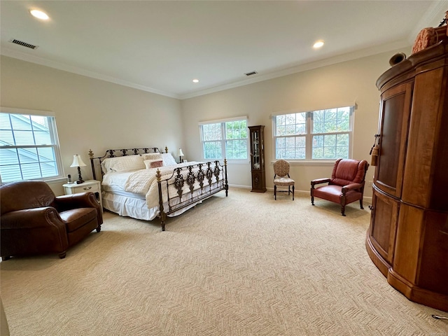 bedroom with light colored carpet and crown molding