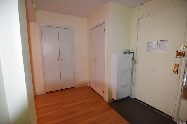 hallway featuring light hardwood / wood-style flooring