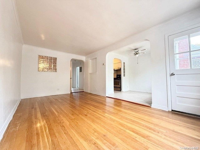 unfurnished room featuring hardwood / wood-style floors, ceiling fan, and ornamental molding