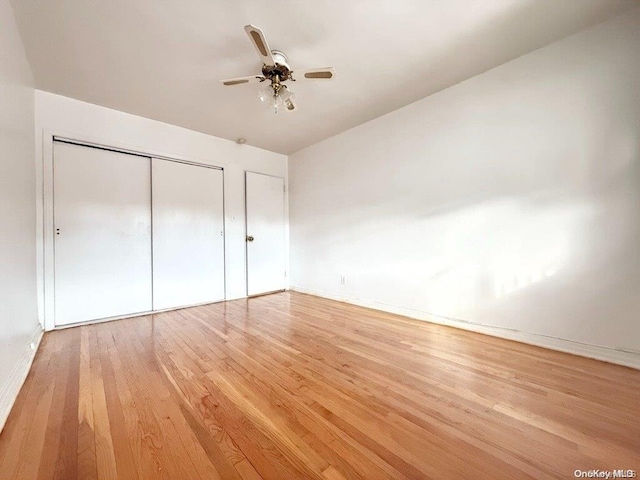 unfurnished bedroom with light hardwood / wood-style floors and ceiling fan