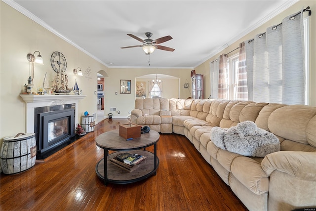 living room featuring ornamental molding, dark hardwood / wood-style floors, and ceiling fan