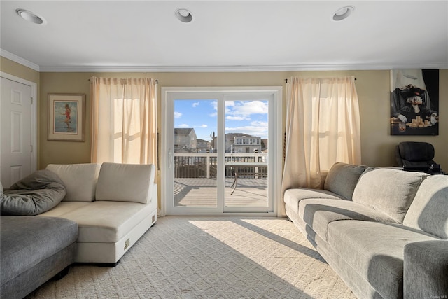 carpeted living room with crown molding