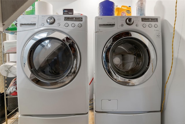 washroom with washer and dryer