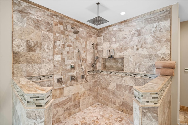 bathroom featuring a tile shower