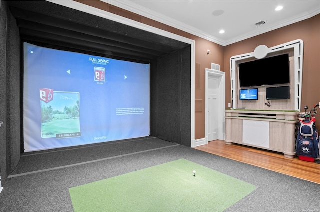 rec room featuring hardwood / wood-style floors, golf simulator, and ornamental molding