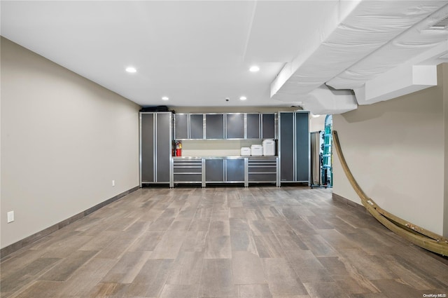 basement featuring hardwood / wood-style flooring