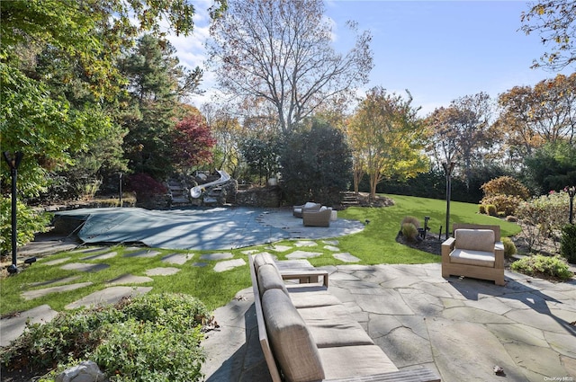 exterior space with an outdoor hangout area and a patio area