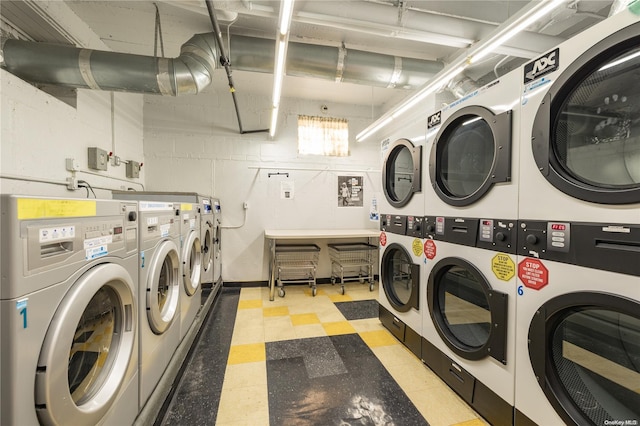 laundry room featuring separate washer and dryer and stacked washer and clothes dryer