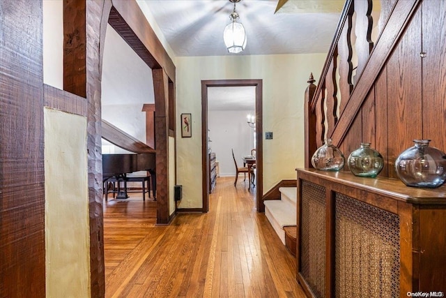 corridor featuring hardwood / wood-style floors