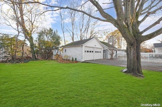 exterior space featuring a garage and an outdoor structure