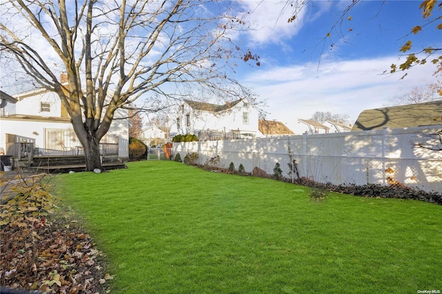 view of yard featuring a wooden deck