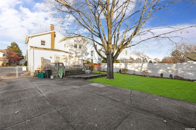 exterior space with a yard and a deck