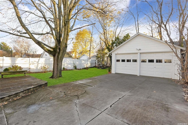 garage featuring a lawn