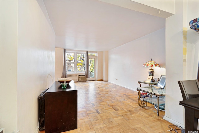 interior space with radiator and light parquet flooring