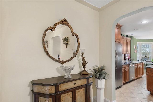 hallway featuring light tile patterned flooring