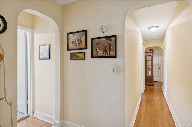 hall with light hardwood / wood-style floors