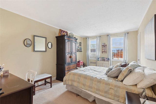 bedroom with light colored carpet and ornamental molding