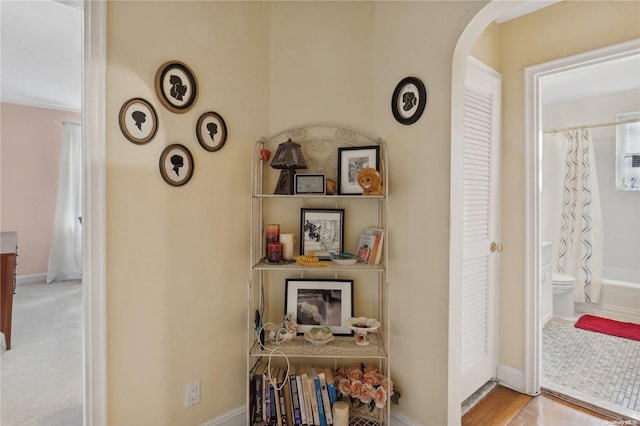 hallway with light hardwood / wood-style flooring