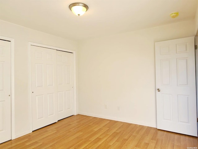 unfurnished bedroom with light hardwood / wood-style flooring