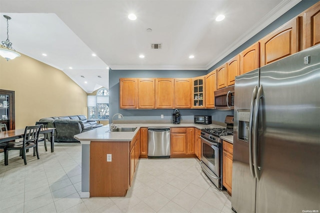 kitchen featuring kitchen peninsula, ornamental molding, stainless steel appliances, sink, and hanging light fixtures