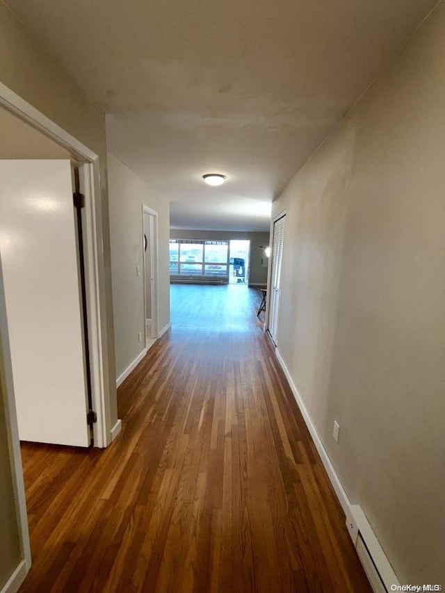 hallway featuring dark hardwood / wood-style floors