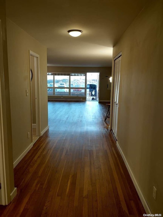 hallway featuring dark hardwood / wood-style floors