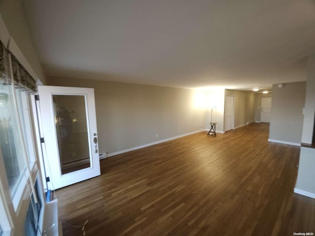 unfurnished living room featuring dark hardwood / wood-style flooring