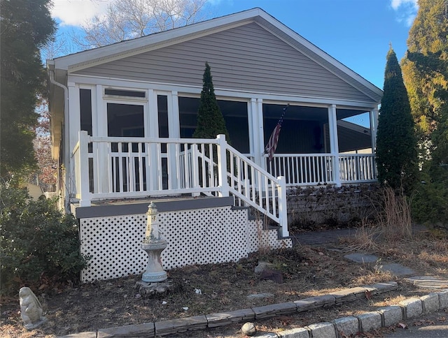 1661 Old Country Rd Unit 521, Riverhead, NY 11901 - view of front facade featuring a sunroom