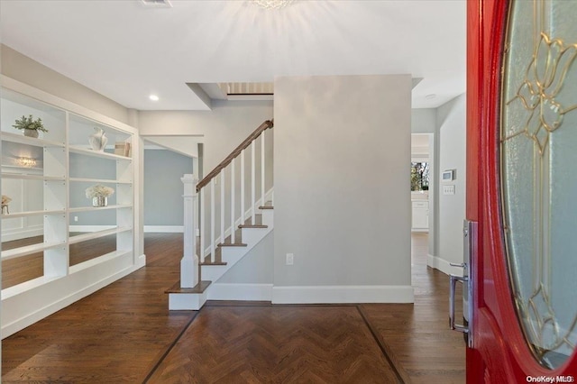 entryway featuring dark parquet floors