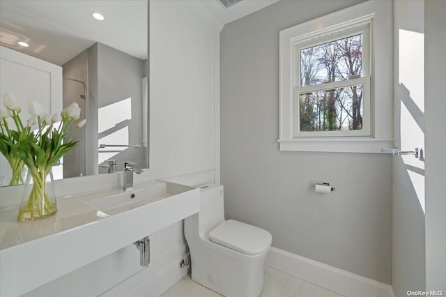 bathroom with tile patterned floors and toilet