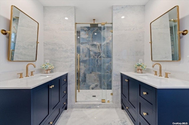 bathroom with vanity, a shower with door, and tile walls