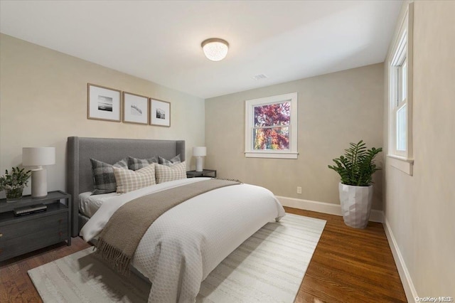 bedroom featuring dark hardwood / wood-style flooring