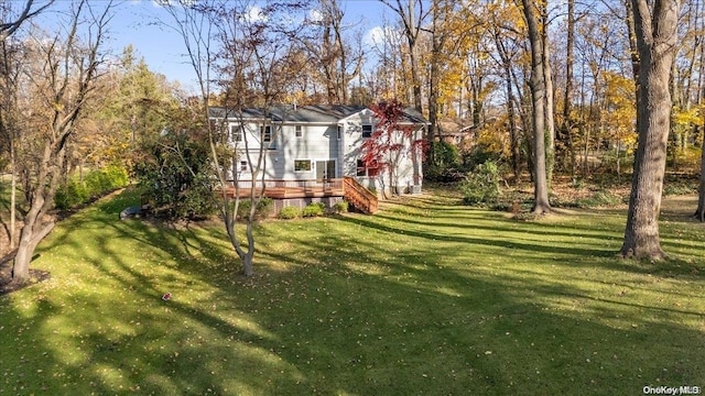 view of yard featuring a wooden deck