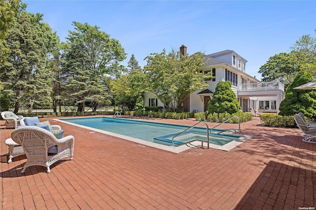 view of swimming pool with a patio