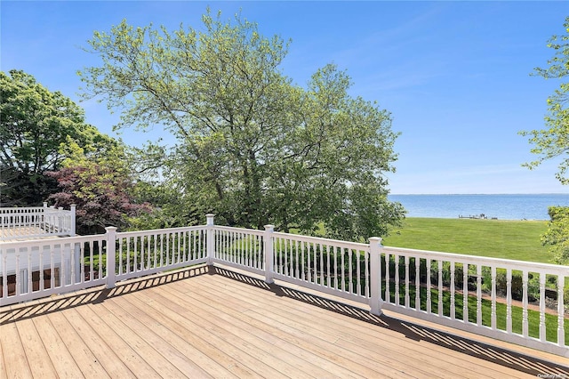 wooden terrace with a water view